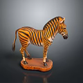 Detailed Zebra Sculpture Carving With Orange And Black Stripes On Wooden Base