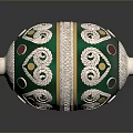 Green And Silver Decorative Container With Ornate Curved Patterns And Colorful Dots
