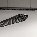 Sleek Modern Black Chandeliers with Honeycomb and Striped Cutout Design Hanging on Light Wall