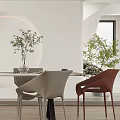 Elegant Modern Restaurant Dining Area With Round Table Chairs Decorative Wall And Potted Plants