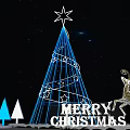 Blue Lit Christmas Tree With Star Top Reindeer Ornament Small Trees And Merry Christmas Sign
