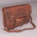 Brown Leather Shoulder Bag With Textured Surface And Gold Zipper Design