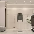 Modern Clothing Store Interior With White Walls Hanging Clothes Racks Sofa Shoes And Green Plant