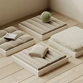Square Poufs in Beige Light Gray Cream on Wooden Floor with Green Tennis Ball Magazine Folded Blanket