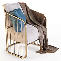 Modern Armchair with Gold Metal Frame Light Gray Cushion Blue Pillow and Brown Knitted Blanket