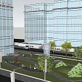 Modern Glass High Rise Buildings Around Urban Green Square With Trees And Pathway