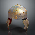 Vintage Ornate Metallic Helmet With Colorful Gemstones And Carved Details