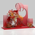 Creative Red Art Installation With Curved Structures Circular Frame And Floral Decorations On Geometric Base