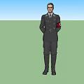 Man in Black Uniform Standing with Hands Behind Back and Badge on Gray Background