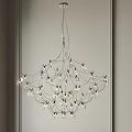 Modern Spider Web Like Chandelier With Multiple Lights Hanging From Ceiling