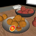 Fresh Red Apples and Sliced Oranges in Black Bowl and White Plate on Wooden Table