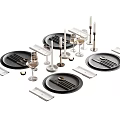 Elegant Modern Dinnerware Set with Black Plates Silver Cutlery Wine Glasses Candle Holders and Placemats
