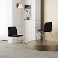 Sleek Black Leather Dining Chairs With Metal Legs By White Tiled Wall And Painting