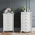 Elegant White Dressers With Golden Handles And Carved Design On Gray Wall Wooden Floor