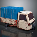 Old Cream White Tricycle Truck With Blue Canvas Cover And Rusty Body