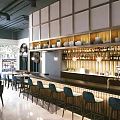 Modern Restaurant Interior With Circular Mirrors Pendant Lights Booth Seating And Round Dining Tables