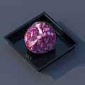 Pink Chunk Food Wrapped in Transparent Plastic on Black Square Tray