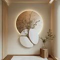Stylish Wall Decor with Circular Illuminated Design Branch Accent and Small Plant on Wooden Base