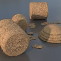Round Hay Bales And Scattered Hay Piles In Natural Rural Setting