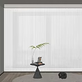 White Vertical Blinds in Modern Interior With Window Small Table Plant Decorations
