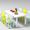 White Kids Table with Yellow and Light Green Chairs and Colorful Building Blocks Toys