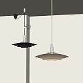 Two Minimalist Pendant Lights With Black And Beige Metal Layered Discs In White Room