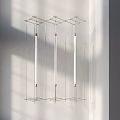 Three Long Linear Modern Chandeliers Vertically Suspended in Interior Space 3d model