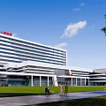 Foshan First Peoples Hospital Modern Exterior With Lawn And Pedestrians
