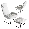 White Upholstered Lounge Chair With Matching Ottoman And Black Metal Legs