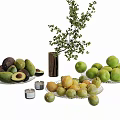 Fresh Avocados Green Apples And Lemons On Glass Plates With Candles Vase And Greenery Branch