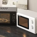 Stylish Black And White Microwave Ovens On Modern Kitchen Counter