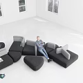 Comfortable Sectional Sofa with Multiple Seats in Bright Room Featuring a Man Sitting by Windows 3d model
