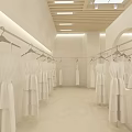 Minimalist White Clothing Store Interior With Clothing Racks Mirror And Decorative Plants