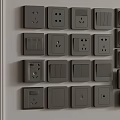 Gray Switch Panels With Various Types Of Switches And Sockets Mounted On Wall