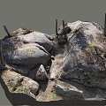 Natural Outdoor Scene Featuring Large Stones And Wooden Posts With Dirt And Wild Grass