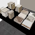 Stacked Books Magazines With Beige Brown Gray Covers Neatly Arranged On Table
