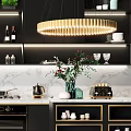 Modern Kitchen Interior With Black Cabinets Gold Accents Marble Countertop And Hanging Chandelier