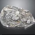 Natural Rock Surface With Crushed Stones Small Green Plants And Rough Texture