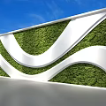 Modern Green Living Wall Design With White Curved Structure And Lush Green Foliage