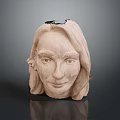 Woman's Head Sculpture With Long Hair Serene Expression Clay Material Dark Background Top Opening Design
