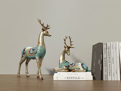 Turquoise Deer Sculptures With Gold Accents Standing And Lying Near KINFOLK Books 3d model