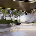 Modern Building Exterior Wall With Curved Metal Grille Green Trees And Lawn Lighting
