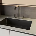 Modern Stainless Steel Kitchen Sink With Faucet On Light Kitchen Countertop