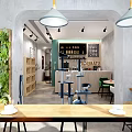Modern Café Interior With Wooden Counter Green Chair Shelves And Cat