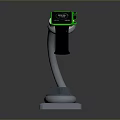 Smartwatch With Green Strap On White Charging Stand And Digital Screen