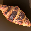 Freshly Baked Golden Brown Croissant With Buttery Layers And Crispy Texture