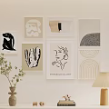 Minimalist Modern Wall Gallery With Various Artworks And Table Decor Items 3d model