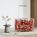 Transparent Single Sofa Filled With Red Cylindrical Objects And Small Table With Green Plant 3d model