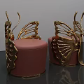 Artistic Golden Butterfly Wing Design Stools With Pink Upholstered Seats And Metal Frames