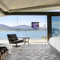 Modern Hotel Room With Lake And Mountain View Fireplace Armchair And Area Rug